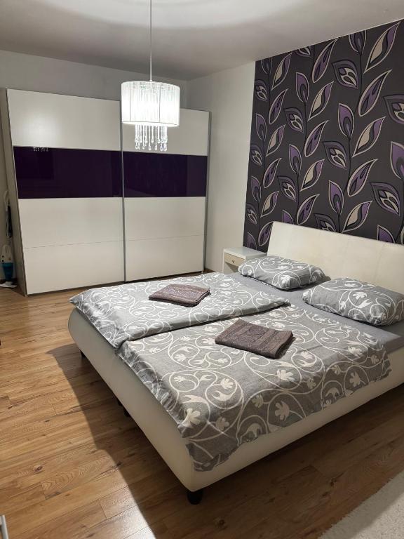 a bedroom with a bed with two pillows on it at Apartman Zvolen in Zvolen
