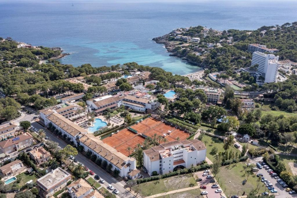 an aerial view of a resort next to the ocean at FERGUS Club Font de Sa Cala Beach in Capdepera