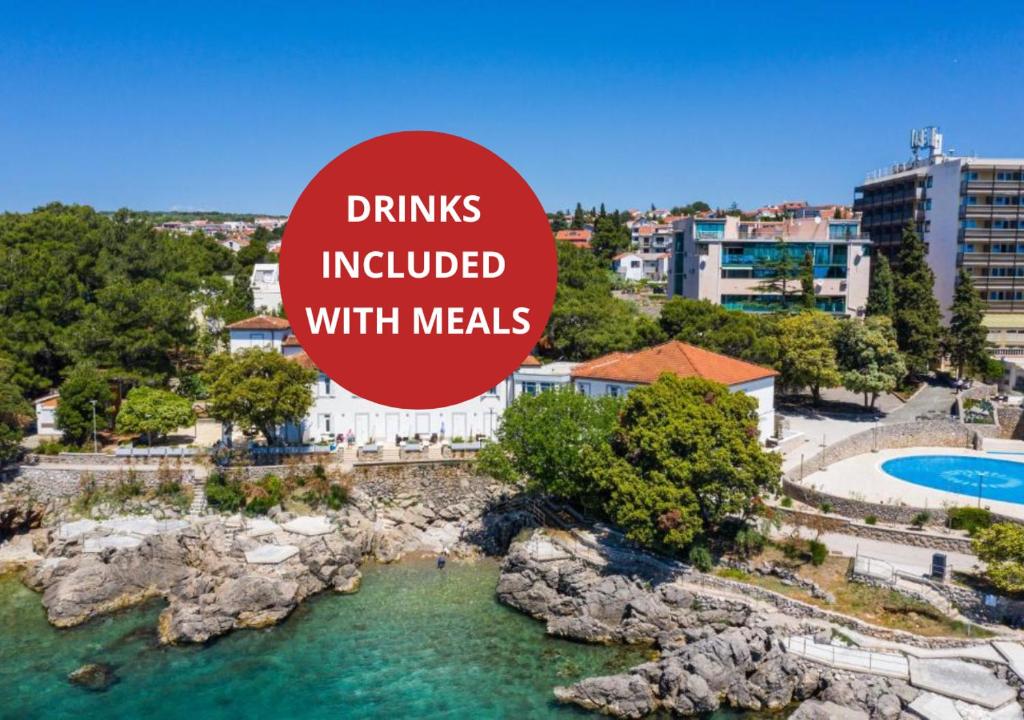 an image of a resort with a sign that reads drinks included with meals at Villa Tamaris - Hotel Resort Dražica in Krk