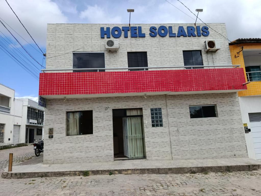 a building with a hotel salars sign on it at Hotel Solaris in Senhor do Bonfim