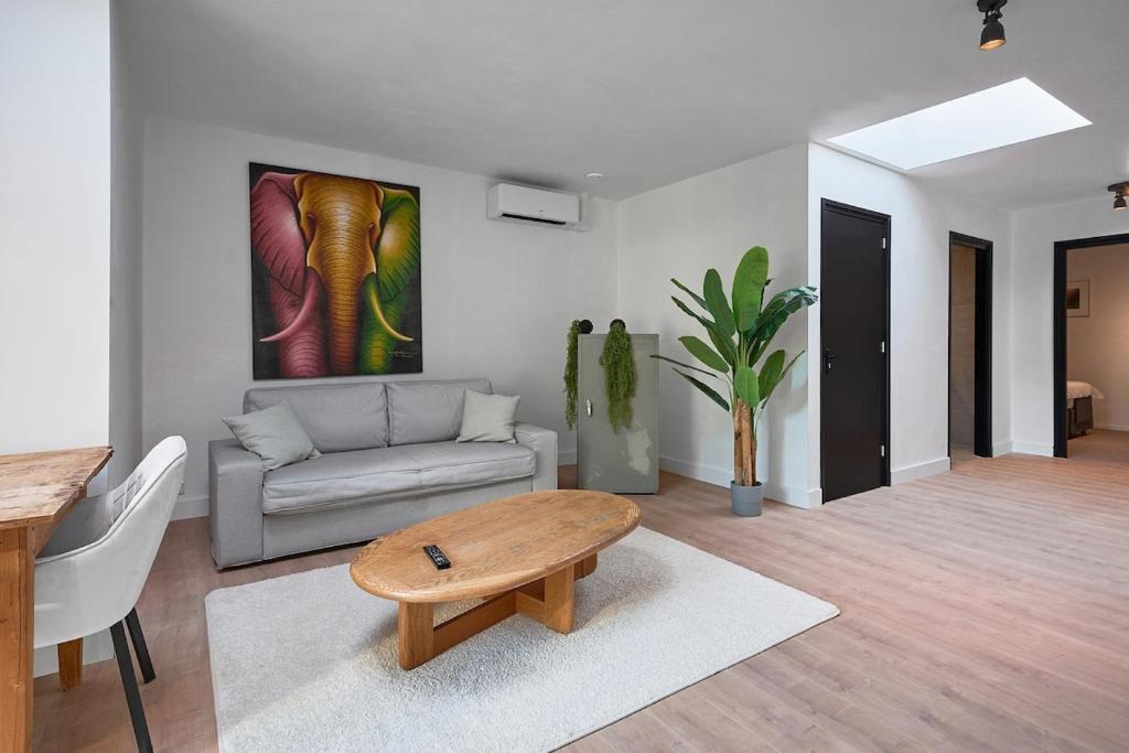 a living room with a couch and a coffee table at The Vault - Eindhoven - By T&S in Eindhoven