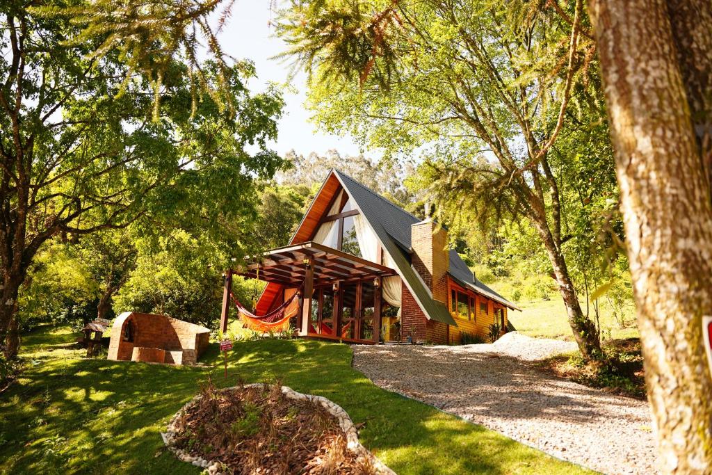 a house in the middle of a forest at Chalet Relaggio in Encantado