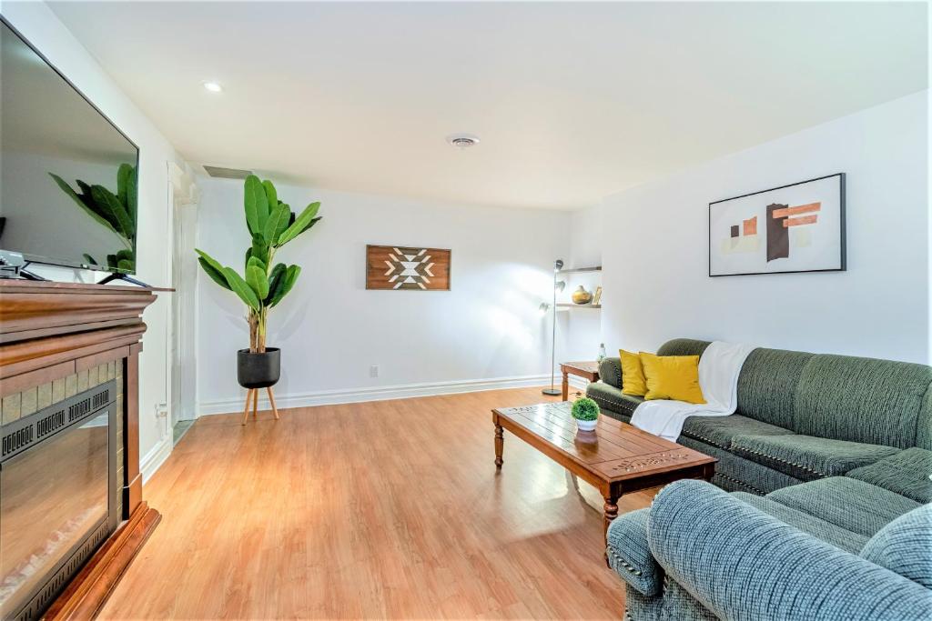 a living room with a couch and a fireplace at Magnifique condo 2 chambres in Beaupré