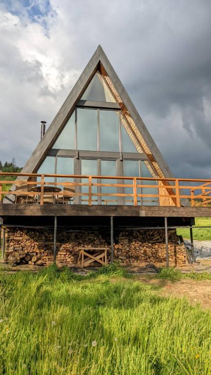 a building with a roof with windows on it at У Потічка in Izki