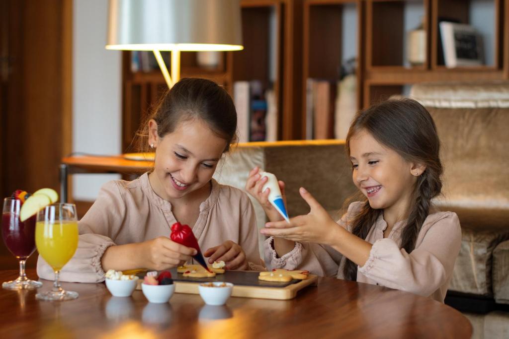 A family-style breakfast scene at a polished dining table.