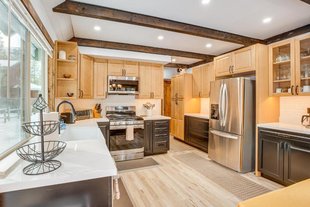 a kitchen with wooden cabinets and stainless steel appliances at Discount Available! Lake Tahoe Gem w/ Pool Table in South Lake Tahoe