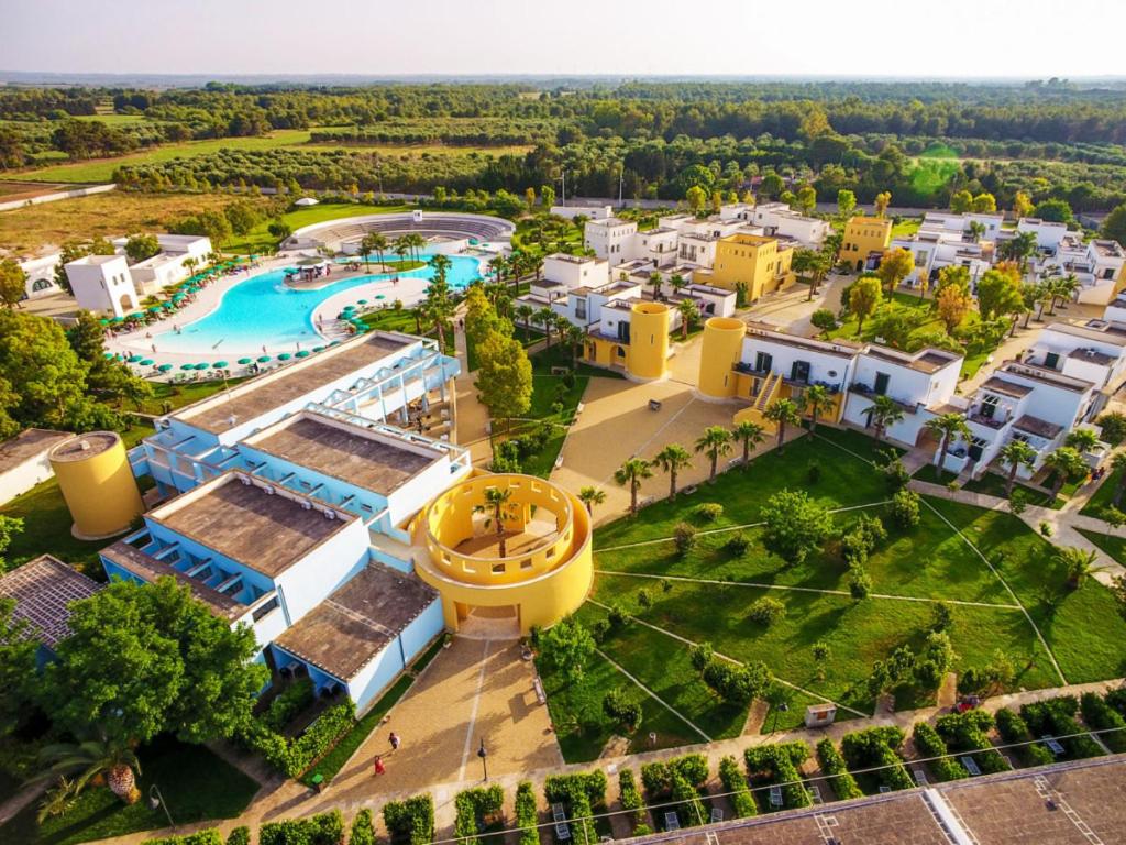 an aerial view of a resort with a pool at Fruit Village Torre dell'Orso La Brunese 4stelle in Torre dell'Orso