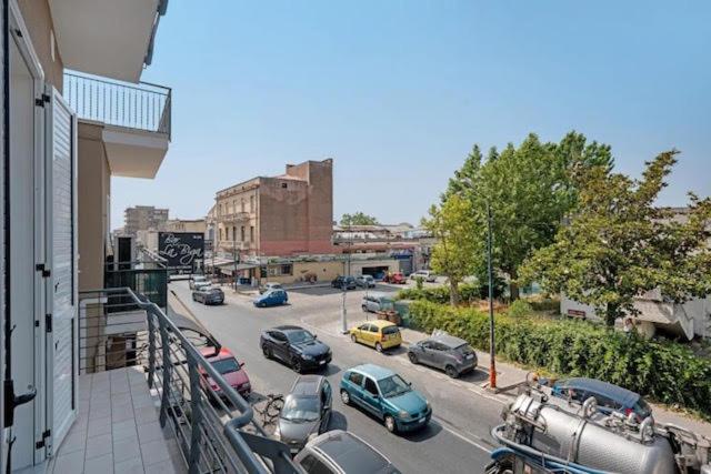a view of a street with cars parked on the road at GRIMALDI ROOMS Costa d'Amalfi in Pagani