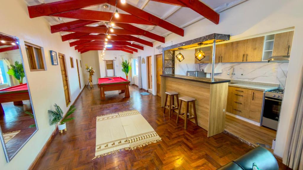 an overhead view of a kitchen with red beams at Apart Hotel de Alegria in Cusco