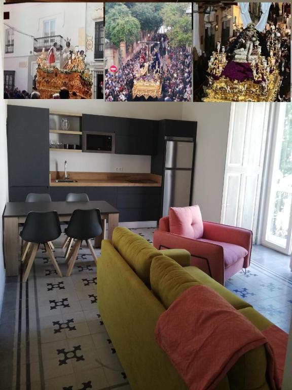 a living room with a couch and a table at CASA PALACIO CABALLEROS 7 con Parking in Sanlúcar de Barrameda