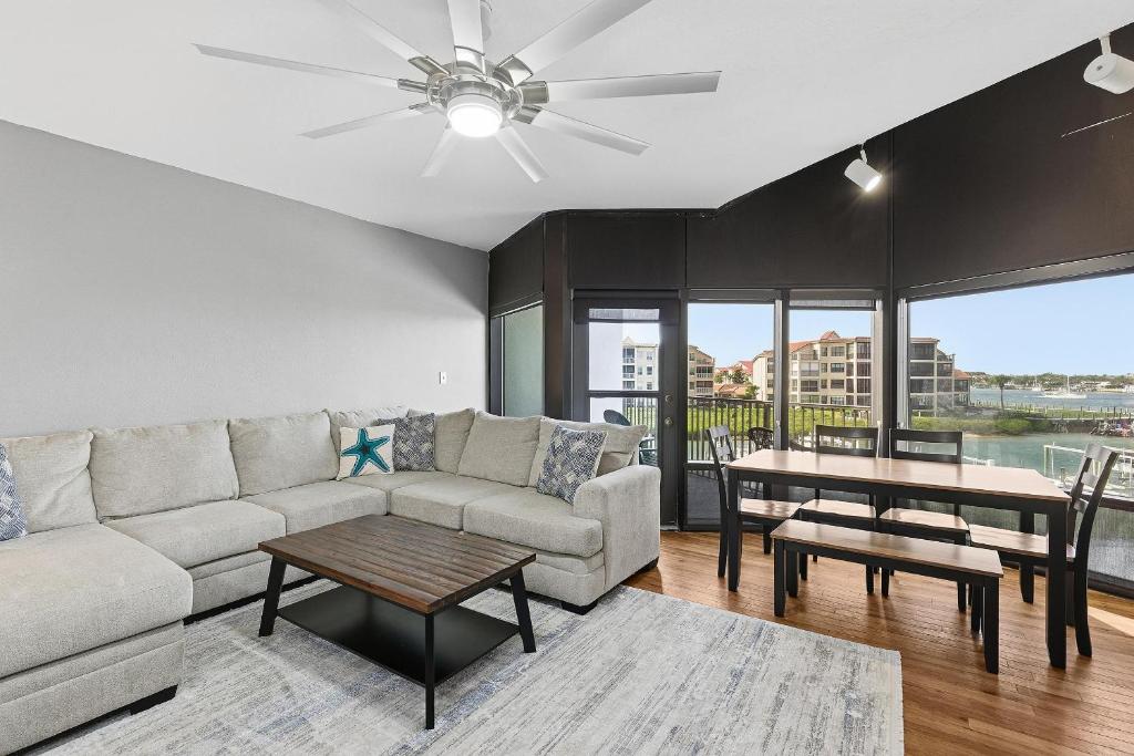 a living room with a couch and a table at Marker 33 #2D3 in New Smyrna Beach