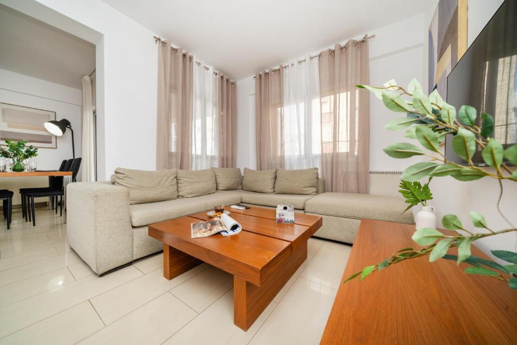 a living room with a couch and a coffee table at 2 bedroom flat in Strovolos