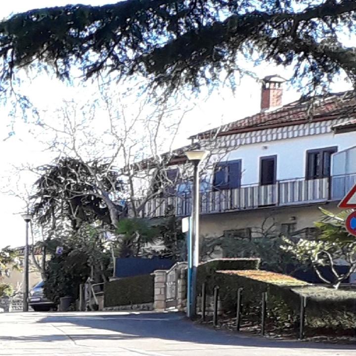 a building with a street light in front of it at Apartment Iva in Rovinj