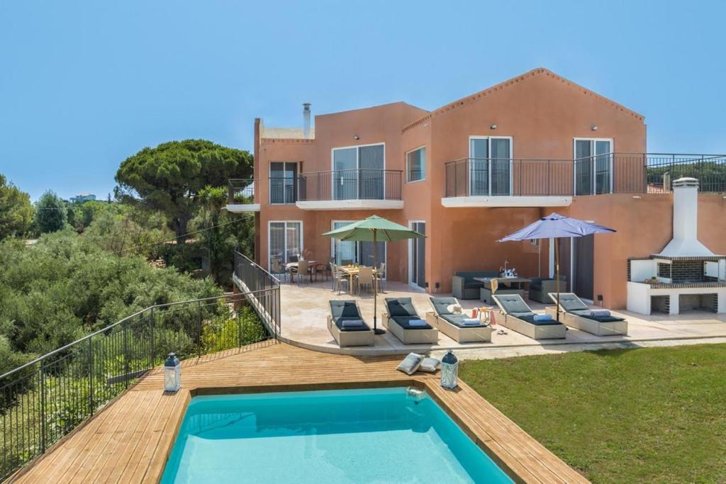 a villa with a swimming pool and a house at Astarte Villas - Casa De Sun Private Villa with Pool in Zakynthos