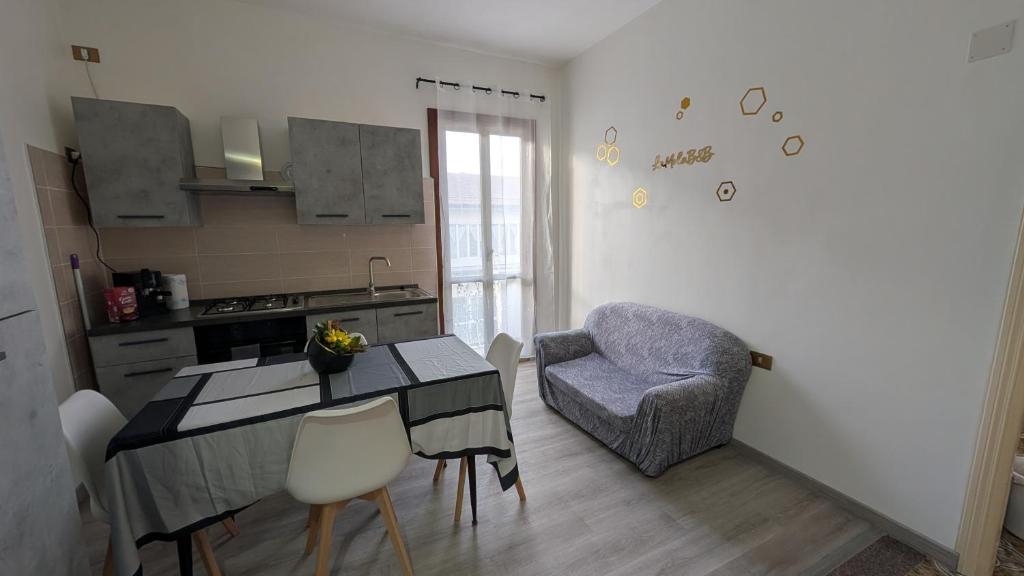 a kitchen with a table and a chair at La Mola B&B in Vignanello
