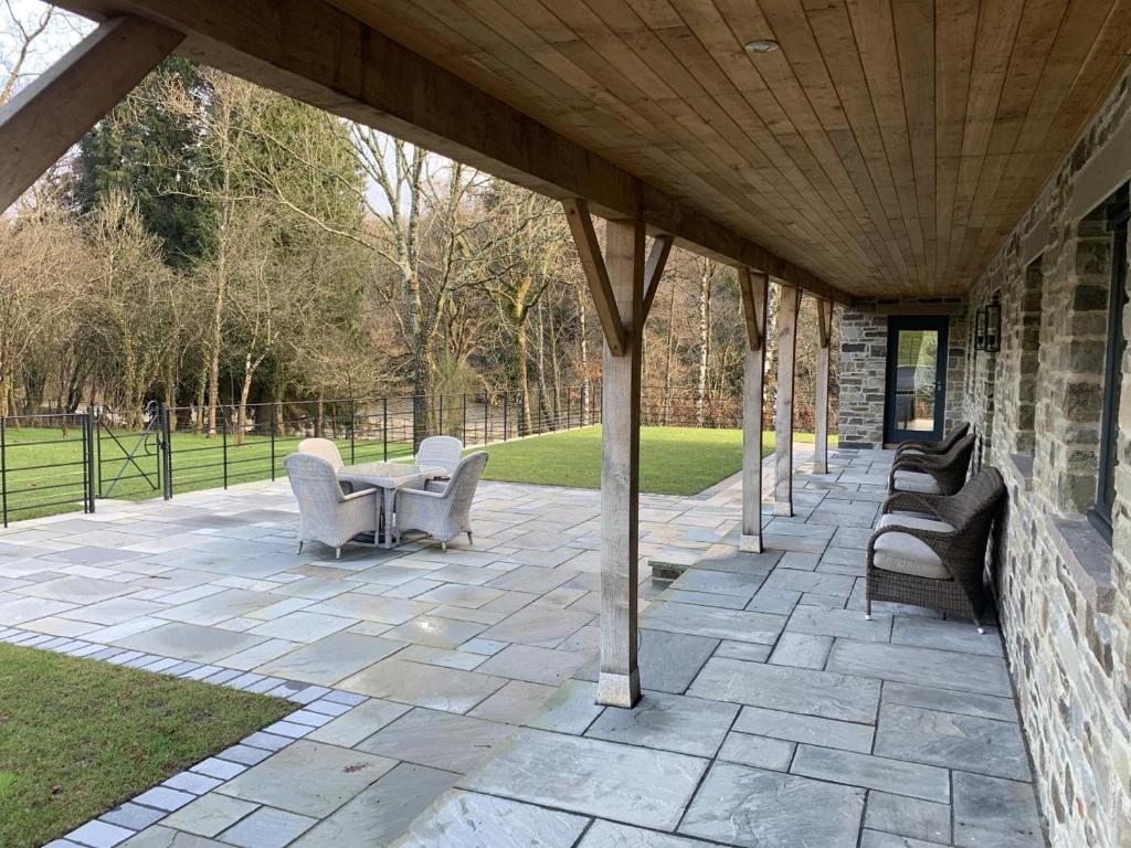 a pavilion with chairs and a table on a patio at 2 Bed in Builth Wells oc-bow198 in Builth Wells