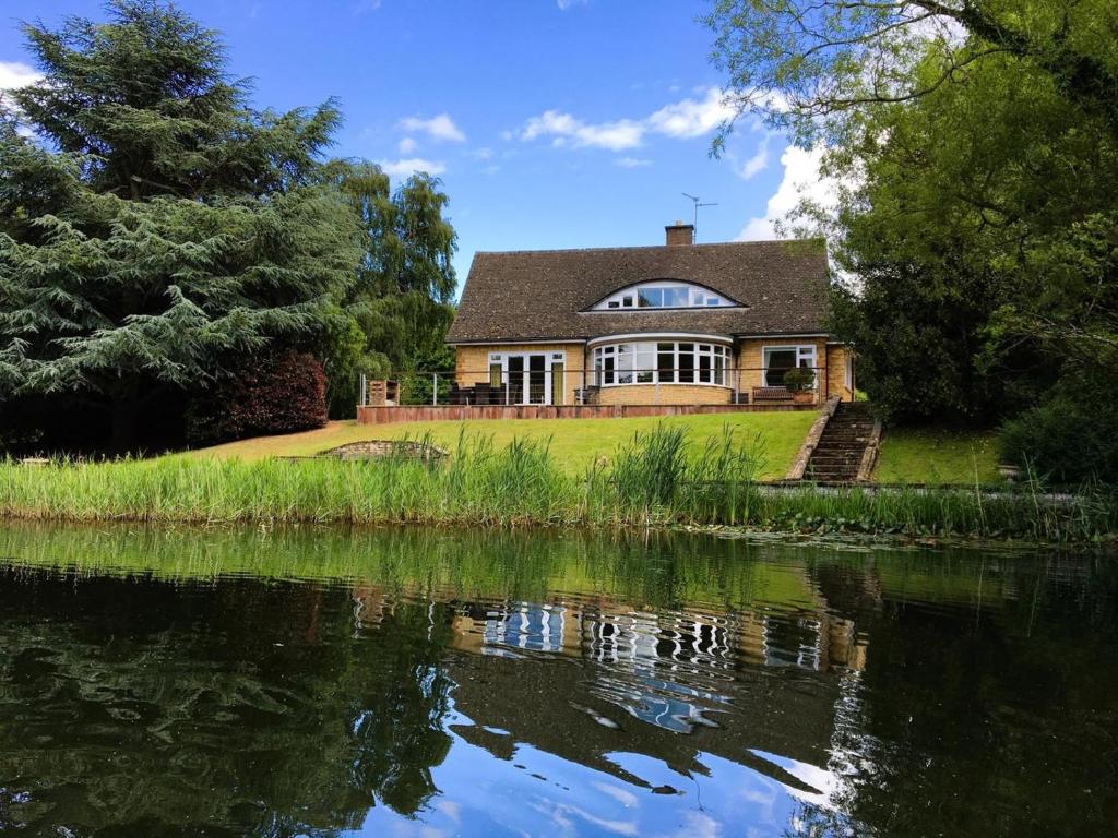a house next to a body of water at 4 Bed in Peterborough oc-93450 in Yaxley