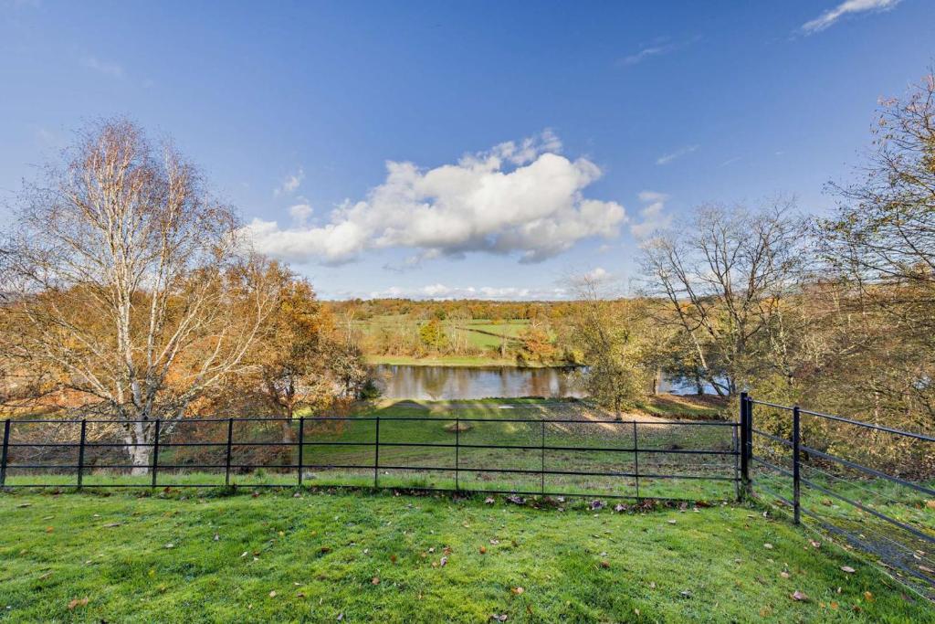 a fence in a field next to a river at 4 Bed in Builth Wells oc-bow197 in Builth Wells