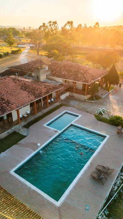 an overhead view of a swimming pool in a house at Pousada Estação Verde in Bonito