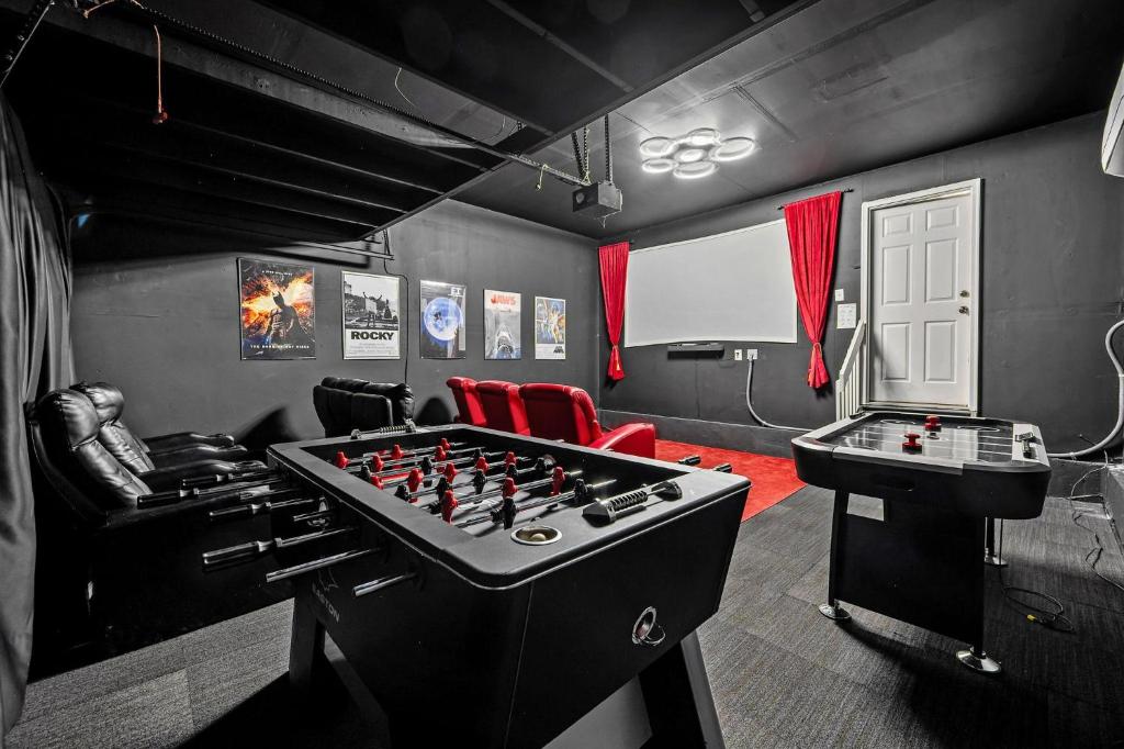 a game room with a large chess board and a table at 1130 Mockingbird St in Brighton