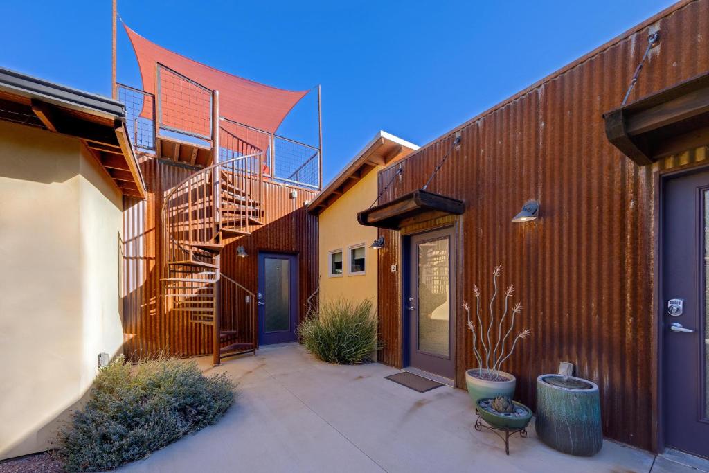 a group of buildings with a staircase in a courtyard at The Entrada Flat 1 in Moab UT in Moab