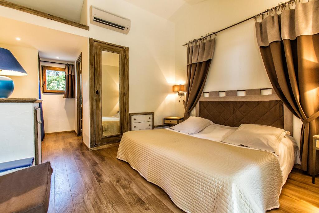 Postel nebo postele na pokoji v ubytování Hôtel Le Belvédère