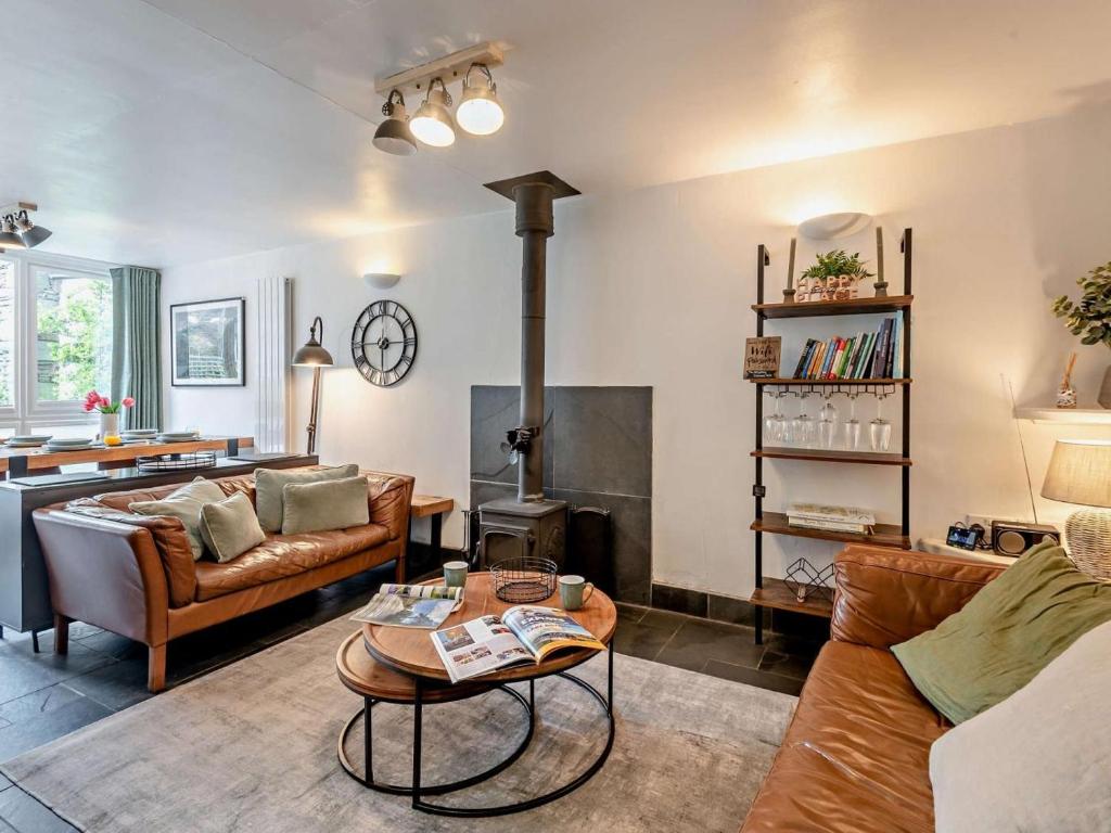 a living room with a couch and a fireplace at 2 Bed in Ambleside oc-sz500 in Grasmere