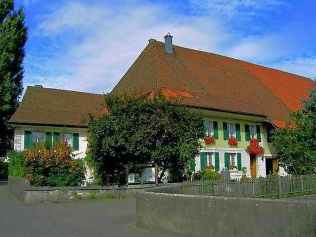 a large house with a brown roof at Apartment Stöckli by Interhome in Attiswil