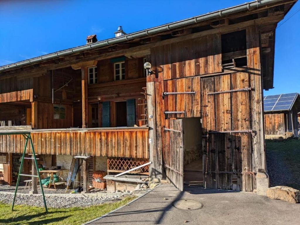 an old wooden building with an open door at Apartment Ferienwohnung by Interhome in Blankenburg