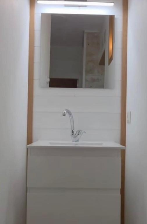 a bathroom with a sink and a mirror at New view in Majdal Shams