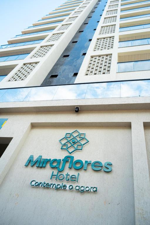 a hotel sign on the side of a building at Miraflores Hotel in Macapá