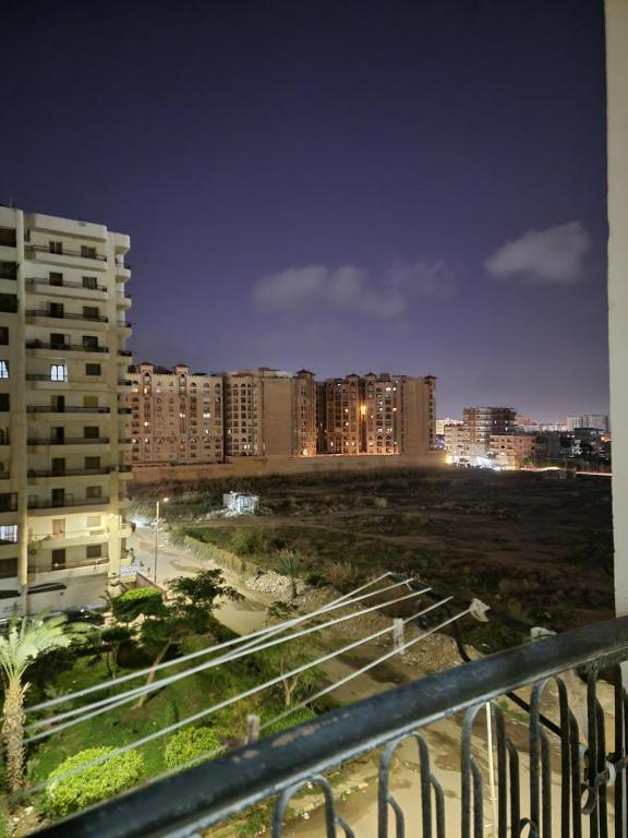 a view of a city at night with buildings at A ROOM in mandara in Alexandria