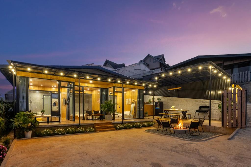 a house with a patio with lights on it at Bin Home in Ấp Kim Thạch