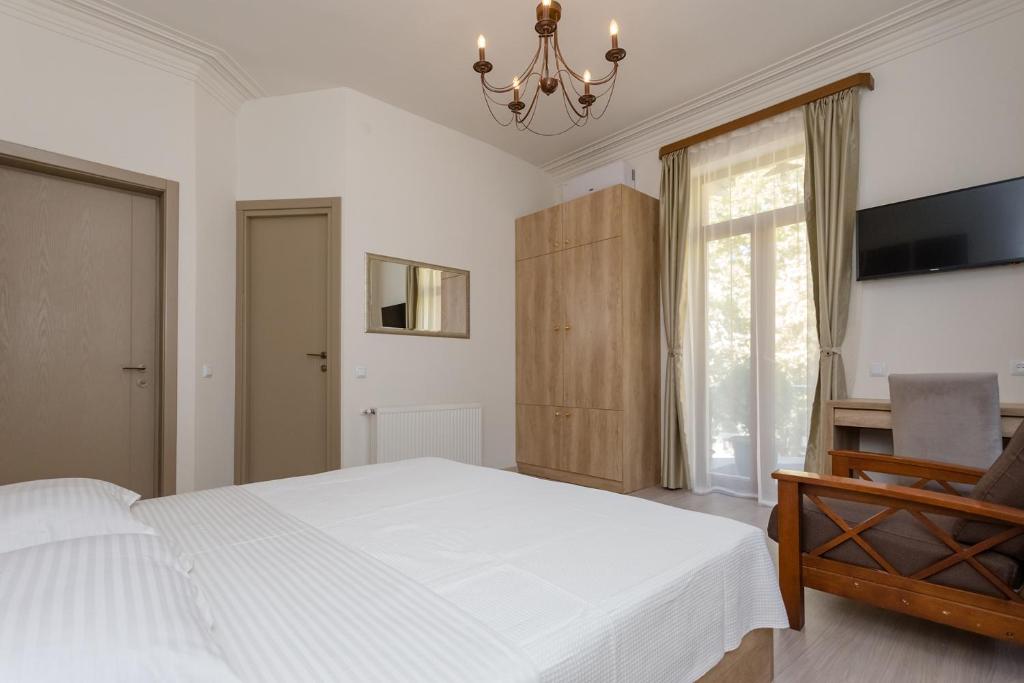 Postel nebo postele na pokoji v ubytování Mais Guest House