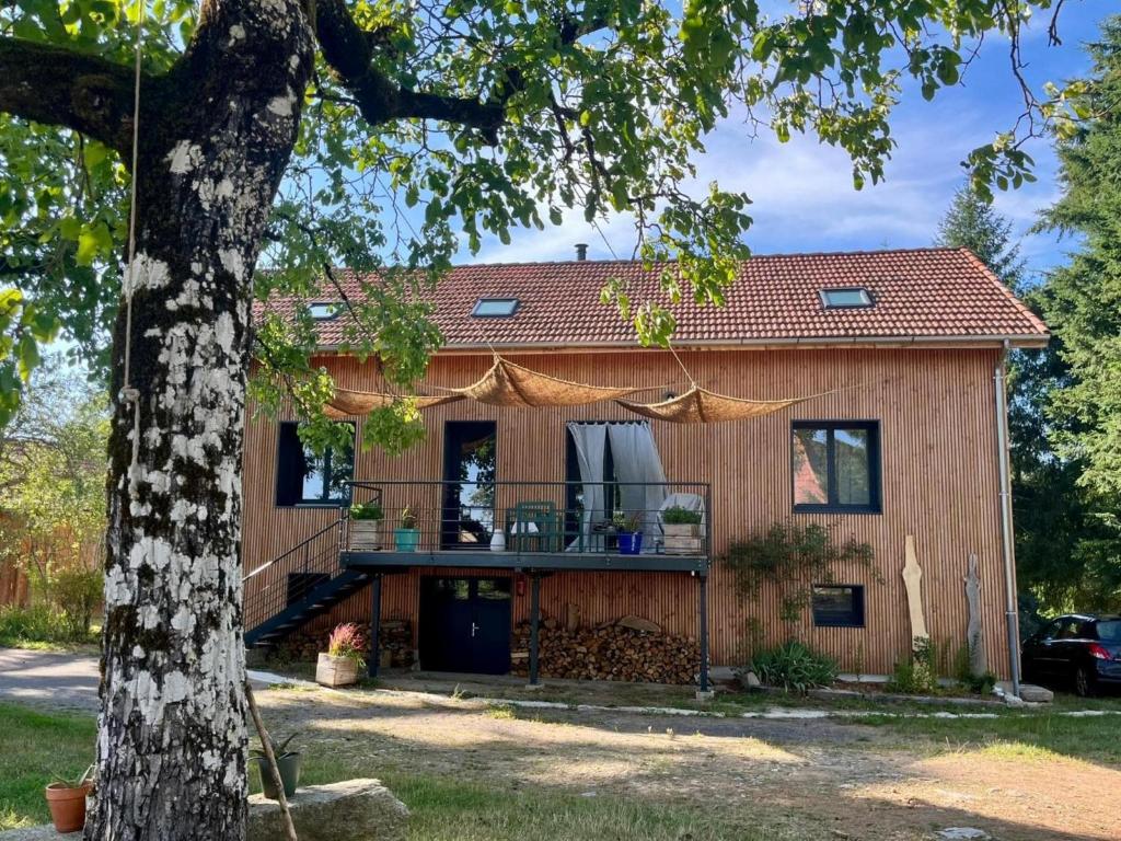 a house with a deck on the side of it at Hilltop Haven in Parlan in Parlan