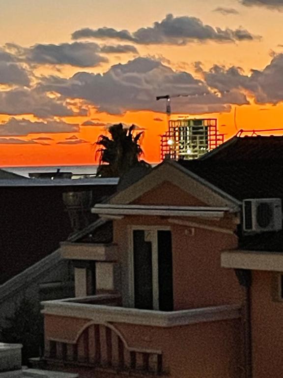 a sunset from the roof of a house at Apartments Budva Sunset in Budva