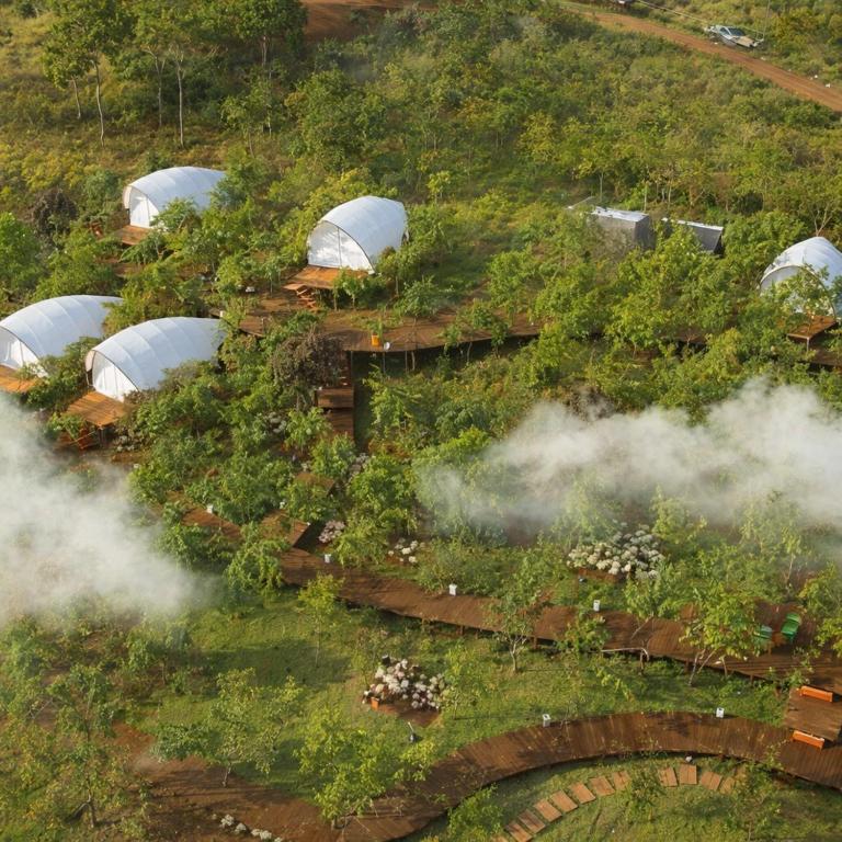 an overhead view of a garden with domes on a hill at Trạm Mây Glamping in Da Lat
