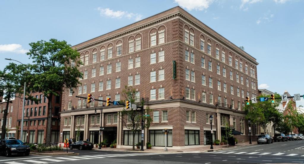 a large brick building on the corner of a street at Hotel Heron Alexandria Old Town, Curio Collection by Hilton in Alexandria