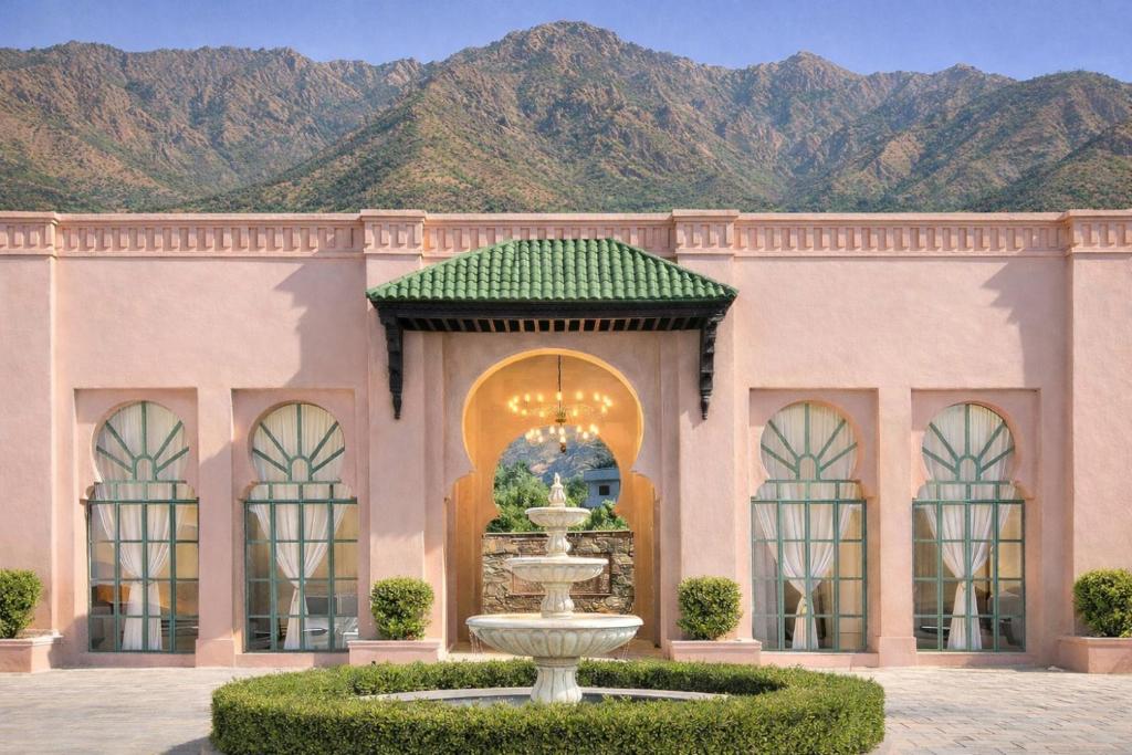 a rendering of a building with a fountain in a courtyard at Sukoon Gah in Bedla