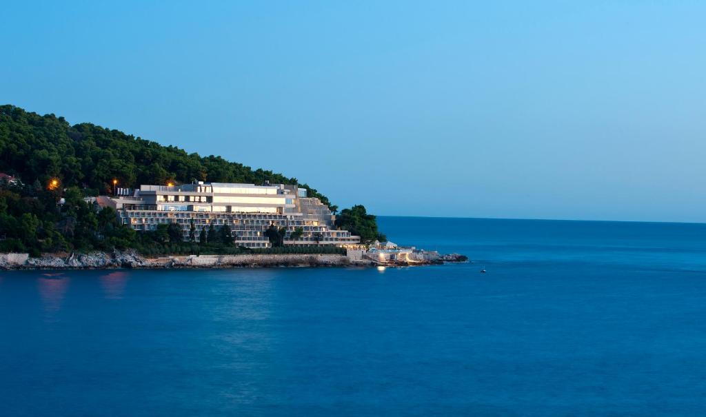 a large building on an island in the water at Hotel Dubrovnik Palace in Dubrovnik