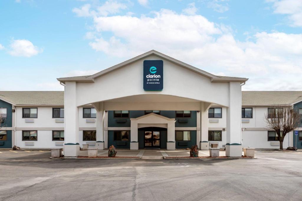 a large white building with a sign on it at Clarion Pointe Prescott Valley in Prescott Valley