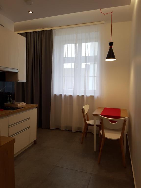 Televízia a/alebo spoločenská miestnosť v ubytovaní Apartamenty Wierzbowa 5
