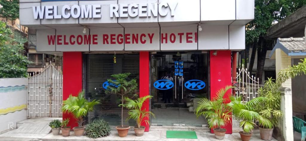 a welcome mercy hotel with plants in front of it at Welcome Regency in kolkata