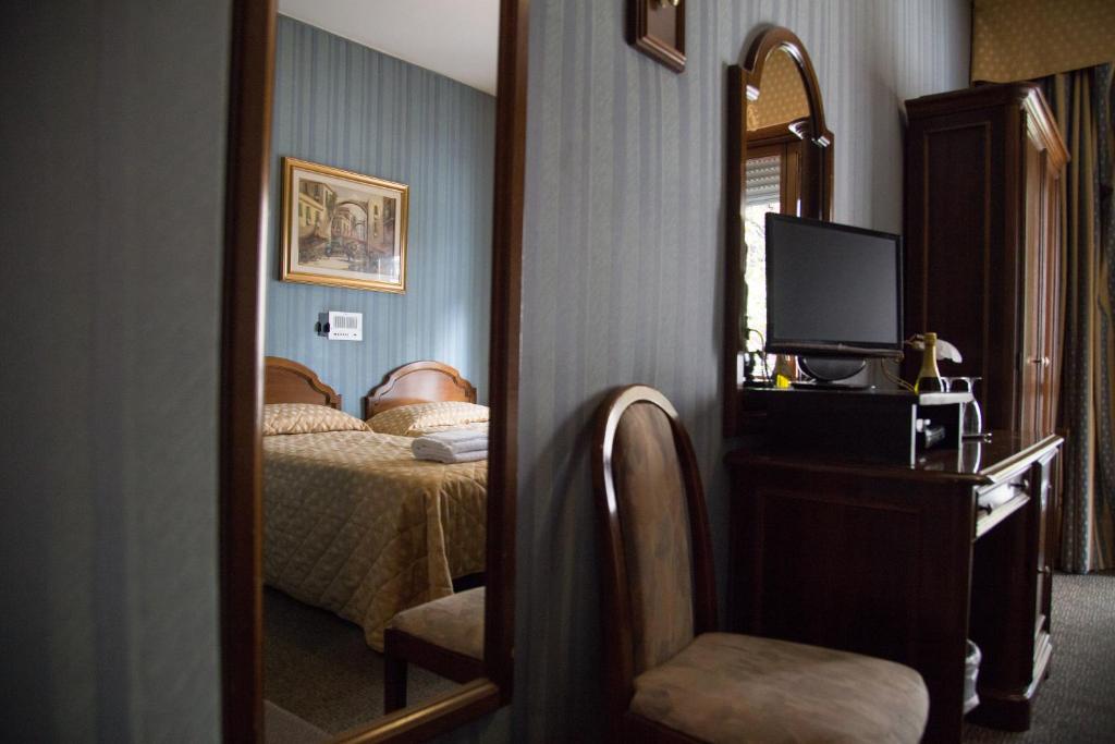 Posteľ alebo postele v izbe v ubytovaní Hotel Accursio