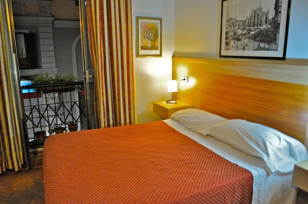 Postel nebo postele na pokoji v ubytování Hotel Dover