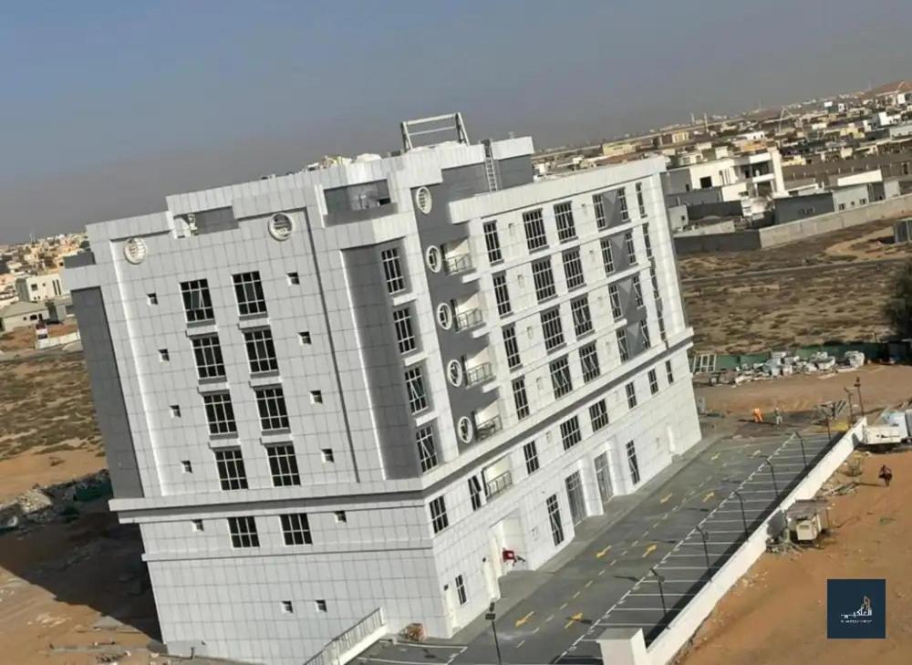 a large white building on the beach at AL ALKEEM HEIGHTS in Ras al Khaimah