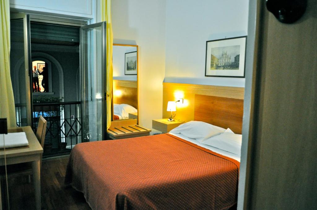 Postel nebo postele na pokoji v ubytování Hotel Dover