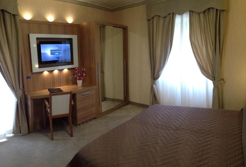 Postel nebo postele na pokoji v ubytování Hotel Vela d'Oro Dependence