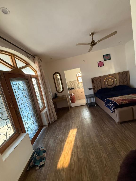 a bedroom with a bed and a window at The elf stays in Dehradun