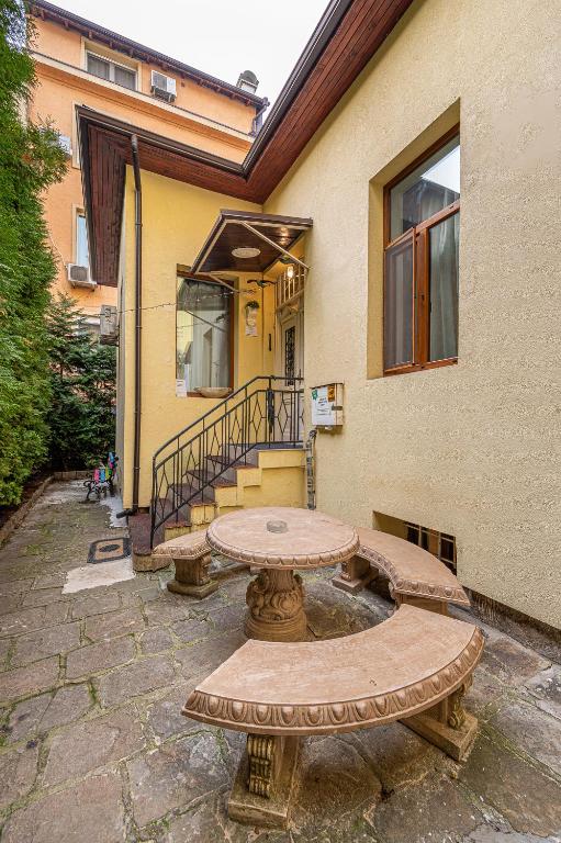 a picnic table in front of a building at Central House for up to 20 Guests Entire Place in Sofia